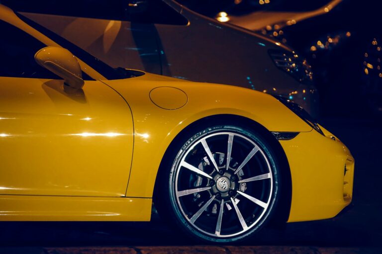 yellow ferrari car in a parking lot